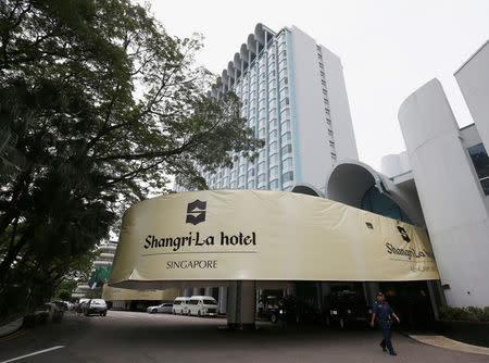 Security personnel patrol outside Shangri-la Hotel during the IISS Shangri-la Dialogue in Singapore June 1, 2018. REUTERS/Edgar Su