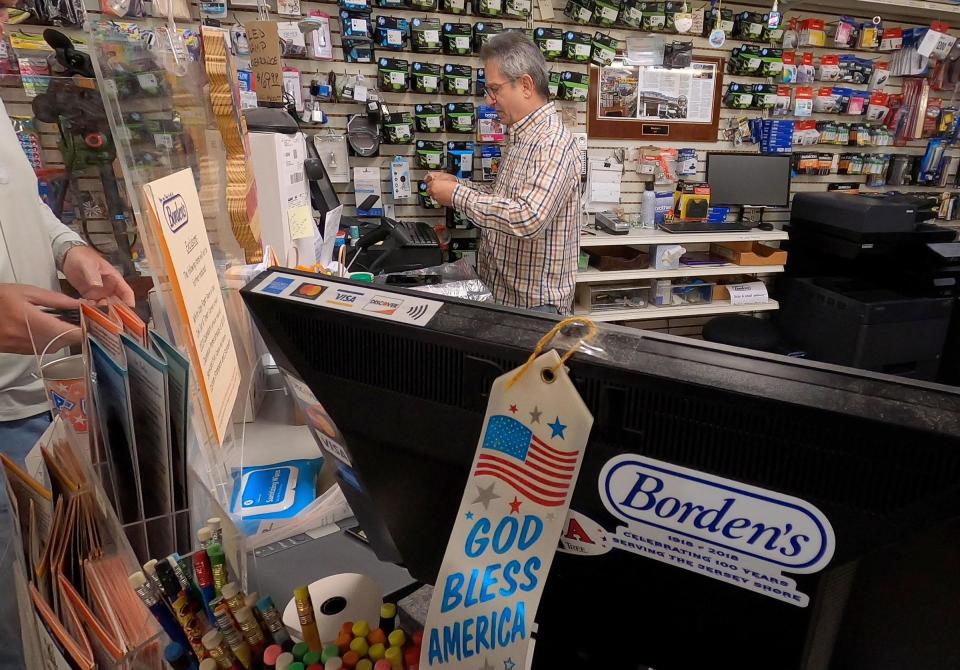 Borden's owner Barry Lubin works behind the counter at the Point Pleasant Beach store Monday, November 14, 2022. The Arnold Avenue shop, which has been a fixture in the town for more than a century, is closing.