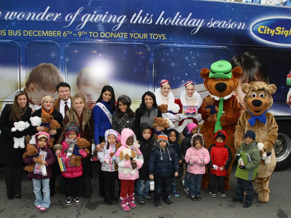Miss USA Rima Fakih, Musician Crystal Bowersox, TV personality Danielle Staub and The Radio City Rockettes along with Yogi Bear and Boo Boo attend CitySights NY's 2010 Holiday Joy Toy Drive at The Children's Aids Society on December 13, 2010 in New York City.