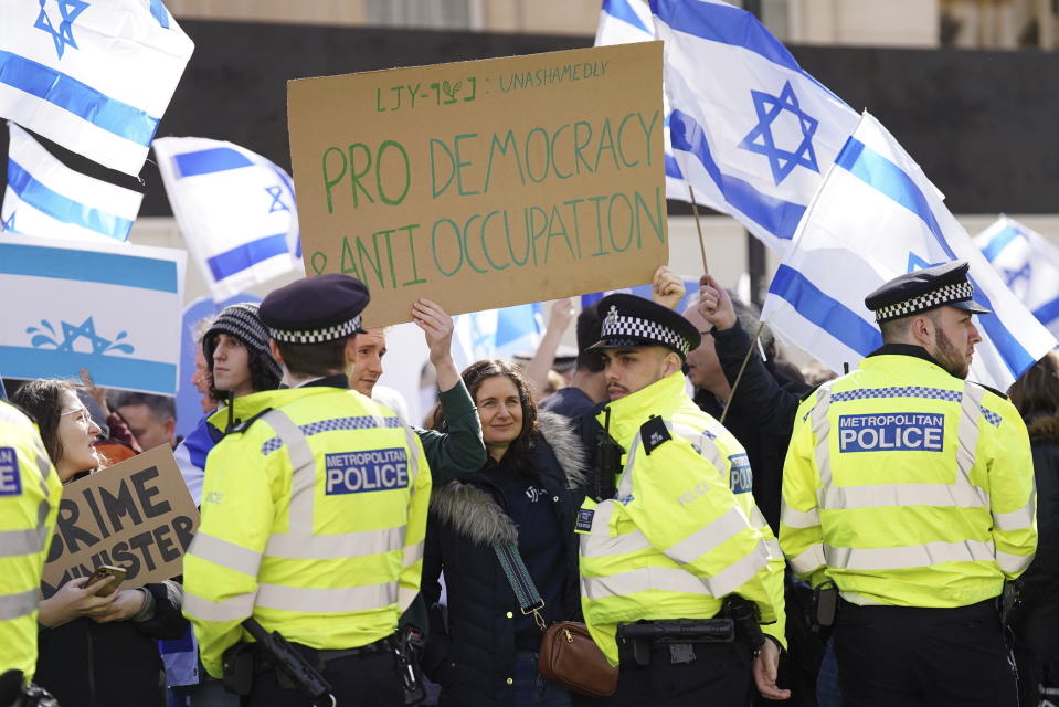 Demonstrators protest against Israeli Prime Minister Benjamin Netanyahu's visit, on Whitehall in London, Friday, March 24, 2023. British Prime Minister Rishi Sunak has welcomed Israeli leader Benjamin Netanyahu to his Downing Street office while demonstrators gathered nearby to protest Netanyahu's right-wing policies. (Stefan Rousseau/PA Wire/PA via AP)