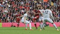 <p>Liverpool’s Mohamed Salah takes a shot</p>