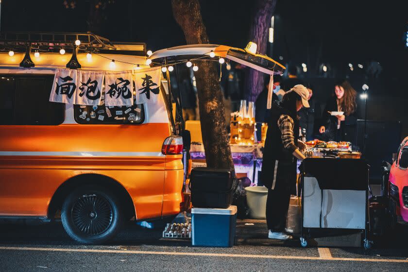 CHENGDU, CHINA - FEBRUARY 03: People tour a night market on February 3, 2023 in Chengdu, Sichuan Province of China. Some vendors sell local specialties carried in car trunks to attract people's attention. (Photo by VCG/VCG via Getty Images)