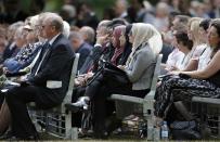 Mourners attend a memorial event to victims of the July 7, 2005 London bombings, at the memorial in Hyde Park, central London, Britain July 7, 2015. Britain fell silent on Tuesday to commemorate the 10th anniversary of attacks targeting London public transport which killed 56 people, the first suicide bombings by Islamist militants in western Europe. (REUTERS/Peter Nicholls)