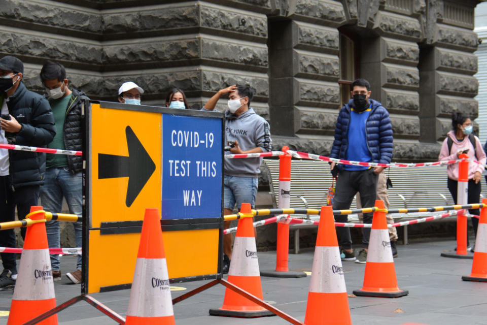 People queue for a Covid-19 PCR test in Melbourne.