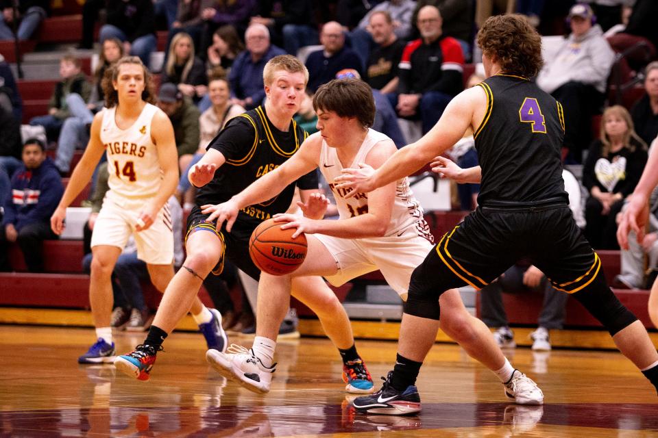 Junction City’s Cooper Rothenberger drives the ball as the Junction City Tigers defeated the Cascade Christian Challengers 67-52 at Junction City High School Tuesday, Jan. 31, 2023.