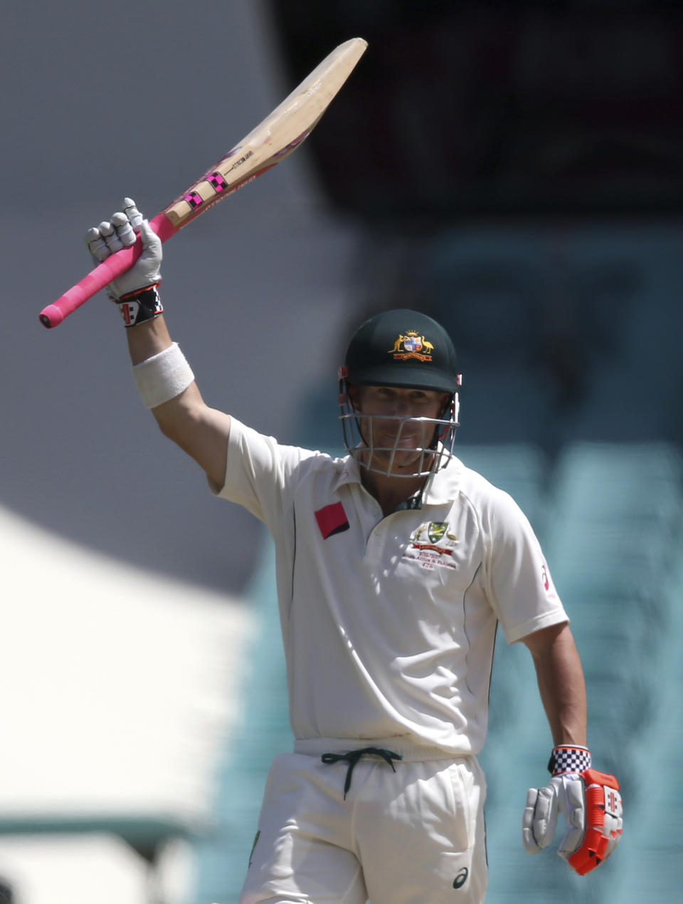 Australia's David Warner raises his bat after scoring a quick 50 runs against Pakistan during their cricket test match in Sydney, Australia, Friday, Jan. 6, 2017. (AP Photo/Rick Rycroft)