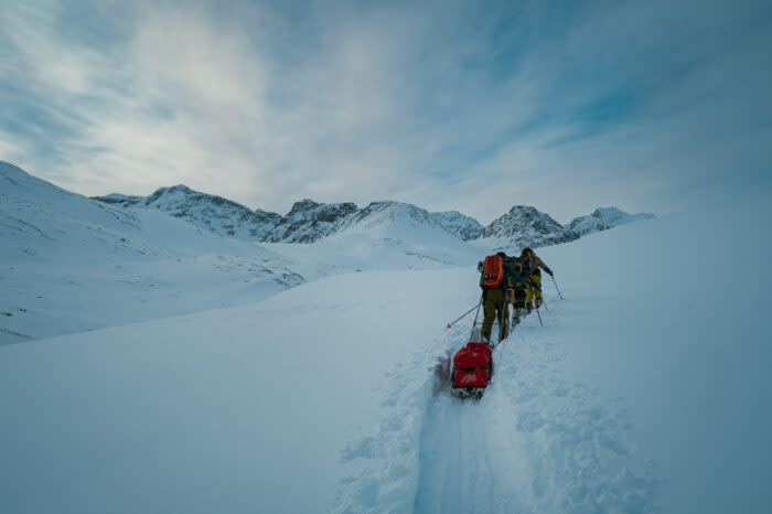 The squad putting quads to work, lugging up sleds; (photo/Mats Drougge Photography)