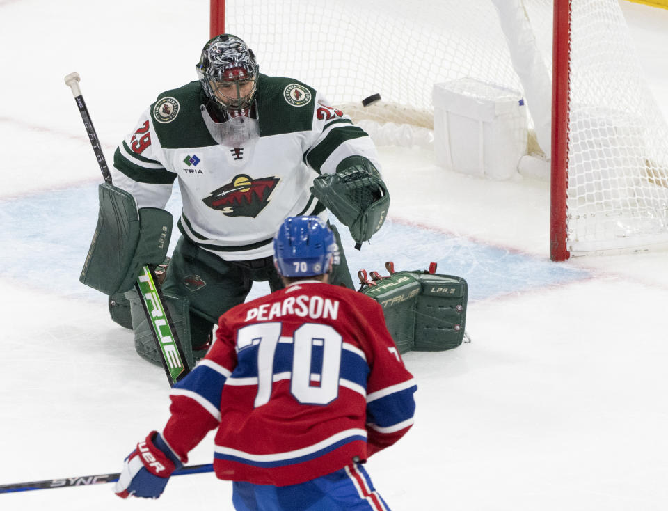 Montreal Canadiens' Tanner Pearson (70) scores on Minnesota Wild goaltender Marc-Andre Fleury (29) during the second period of an NHL hockey game, Tuesday, Oct. 17, 2023 in Montreal. (Christinne Muschi/The Canadian Press via AP)