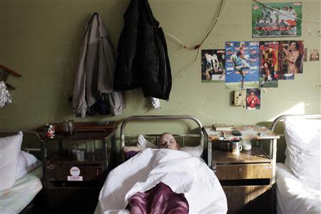 A patient sleeps in a ward in a hospital in the Russian town of Tver, in this February 21, 2011 file photograph. REUTERS/Diana Markosian/Files