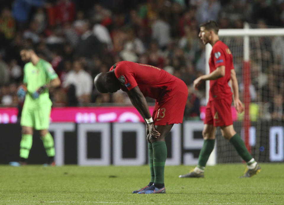 Portugal's Danilo reacts at the end of the Euro 2020 group B qualifying soccer match between Portugal and Serbia at the Luz stadium in Lisbon, Portugal, Monday, March 25, 2019. (AP Photo/Armando Franca)