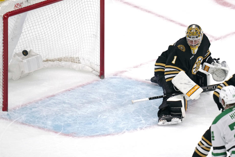Boston Bruins goaltender Jeremy Swayman (1) gives up a goal to Dallas Stars defenseman Esa Lindell (23), not shown, during the third period of an NHL hockey game, Monday, Feb. 19, 2024, in Boston. (AP Photo/Charles Krupa)