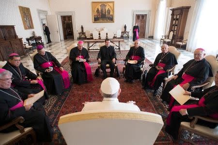 Pope Francis poses with bishops members of the Costa Rica episcopal conference at the Vatican February 13, 2017. Osservatore Romano/Handout via REUTERS