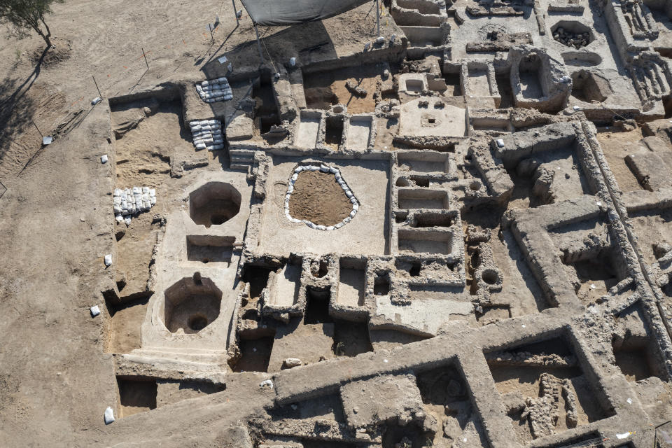 An aerial picture taken by a drone shows a massive ancient winemaking complex dating back some 1,500 years in Yavne, south of Tel Aviv, Israel, Monday, Oct. 11, 2021. Israeli archaeologists said the complex includes five wine presses, warehouses, kilns for producing clay storage vessels and tens of thousands of fragments and jars. (AP Photo/Tsafrir Abayov)