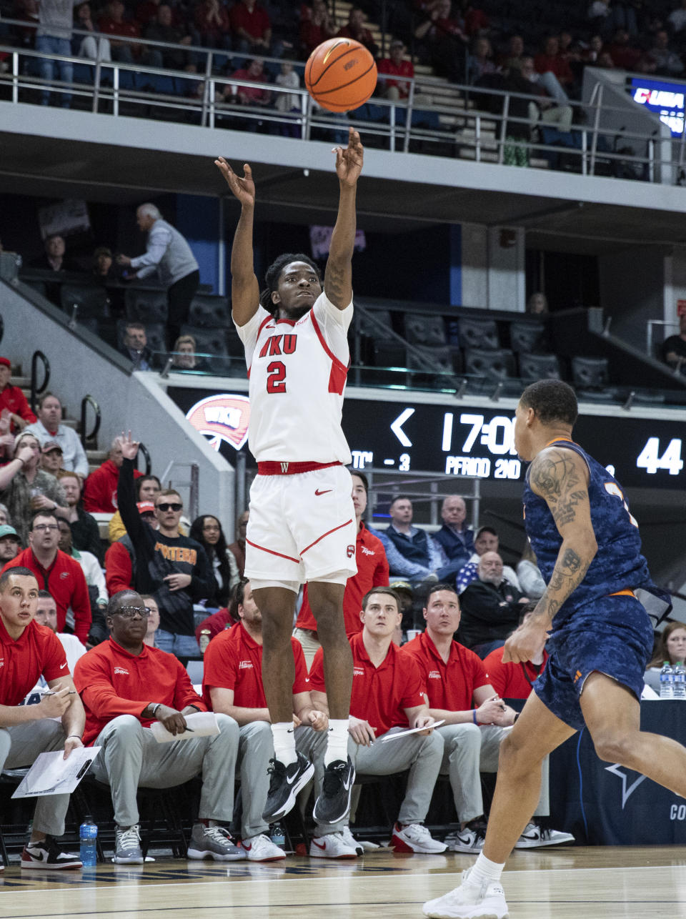 Western Kentucky junior guard Don McHenry (2) shoots a three-pointer over UTEP senior guard Zid Powell (0) in the Hilltoppers' 78-71 win over the Miners in an NCAA college basketball game to become the Conference USA men's basketball champions for the first time since 2013 at VBC Propst Arena in Huntington, Ala., on Saturday, March 16, 2024. WKU advances the NCAA tournament. (Grace Ramey/Daily News via AP)