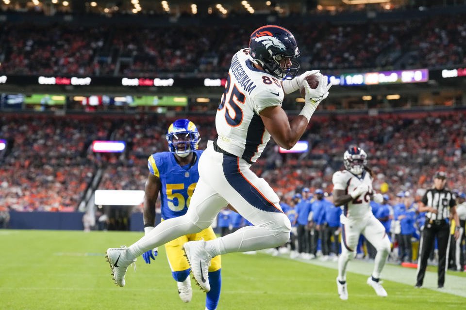 Denver Broncos tight end Albert Okwuegbunam catches a touchdown pass against the Los Angeles Ramsduring the first half of an NFL preseason football game Saturday, Aug. 26, 2023, in Denver. (AP Photo/David Zalubowski)