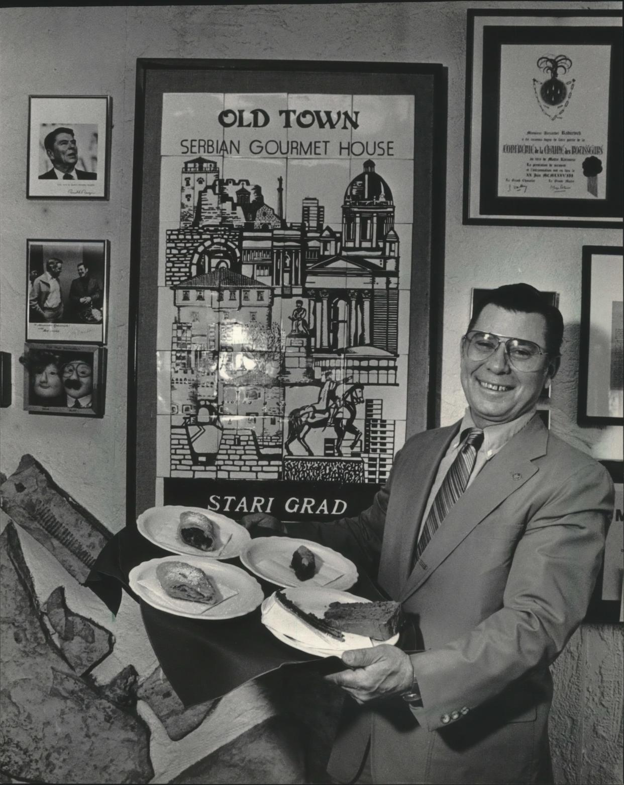 Alexander Radicevich, one of the founders, is shown with desserts at Old Town Serbian Gourmet House in 1985. The restaurant is marking 50 years with a brunch and happy hour.