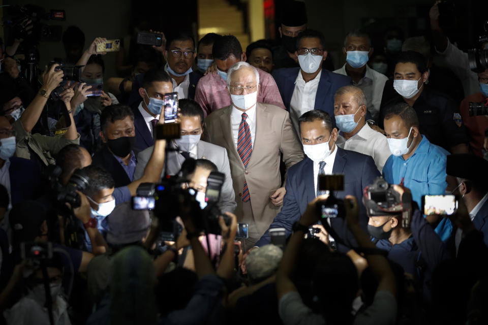 FILE - Former Malaysian Prime Minister Najib Razak leaves the court house in Kuala Lumpur, Malaysia, July 28, 2020. Najib Razak on Tuesday, Aug. 23, 2022 was Malaysia’s first former prime minister to go to prison -- a mighty fall for a veteran British-educated politician whose father and uncle were the country’s second and third prime ministers, respectively. The 1MDB financial scandal that brought him down was not just a personal blow but shook the stranglehold his United Malays National Organization party had over Malaysian politics. (AP Photo/Vincent Thian, File)