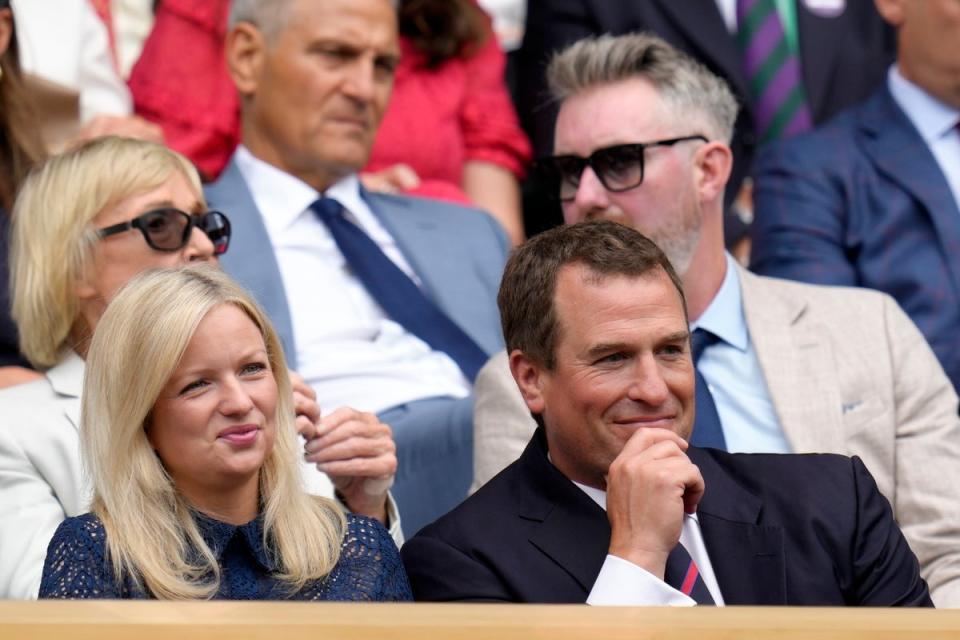 Peter Phillips and girlfriend Lindsay Wallace in the Royal Box at Wimbledon on 6 July (AP)