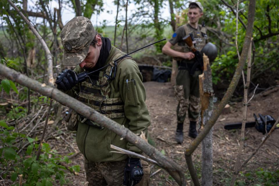 Ukrainian Army officer uses a radio in Kharkiv