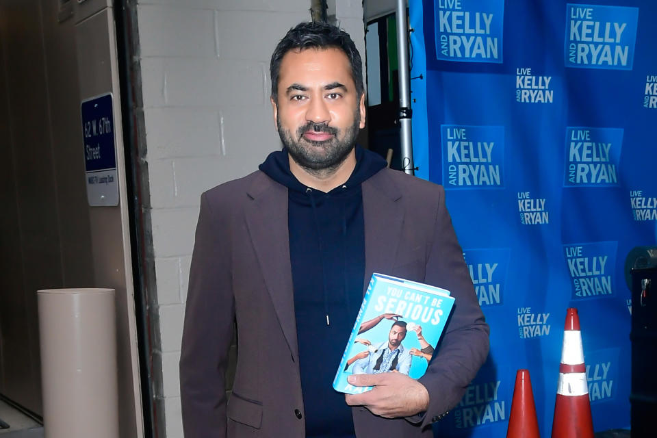 Photo of Kal Penn holding his book "You Can't Be Serious"