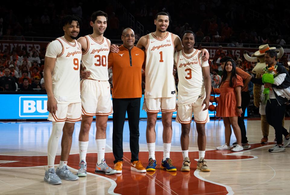 Texas head coach Rodney Terry, center, poses with outgoing seniors Ithiel Horton, Brock Cunningham, Dylan Disu and Max Abmas during the team's Senior Night ceremony on March 9.