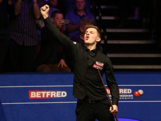 Cahill celebrates his victory over O'Sullivan at the World Snooker Championship (PA)