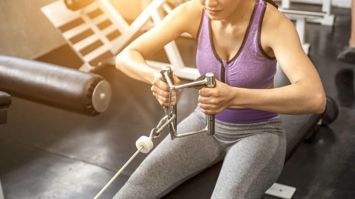 woman at the gym working out on a machine