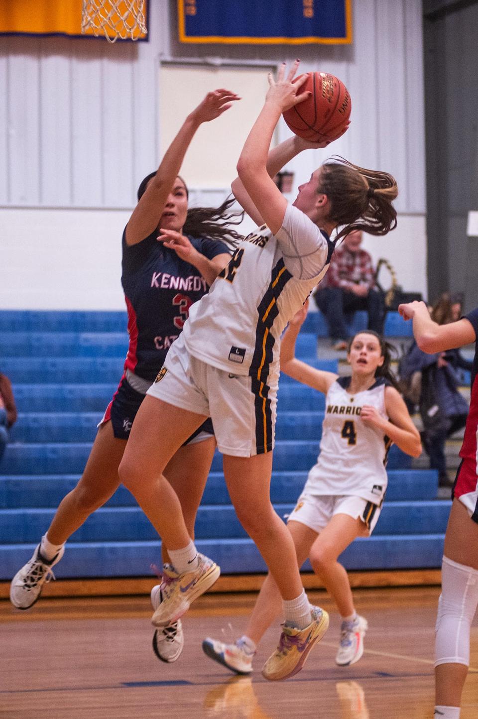 Lourdes' Simone Pelish, right, shoots during the girls basketball game at Our Lady of Lourdes High School in Poughkeepsie, NY on Saturday, December 9, 2023. Loudes defeated Kennedy 65-38. KELLY MARSH/FOR THE POUGHKEEPSIE JOURNAL