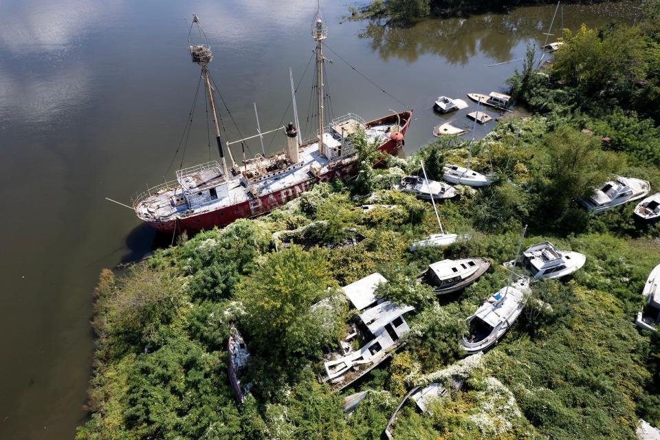 The Barnegat Lightship sits among other abandoned boats in the Pyne Point Marina along the Camden waterfront Monday, September 11, 2023. The former Coast Guard lightship, commissioned in 1904 and decommissioned in 1967, was once stationed off Long Beach Island.