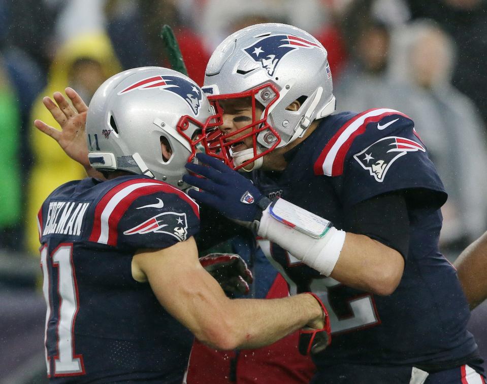 Published Caption:              Patriots quarterback Tom Brady celebrates with receiver Julian Edelman after a first quarter touchdown gave New England a 17-0 lead over Cleveland on Sunday at Gillette Stadium. [The Providence Journal/Bob Breidenbach] Original Caption:  Sunday October 27, 2019 Foxboro, MA [The Providence Journal/Bob Breidenbach] New England Patriots host the Cleveland Browns at Gillette Stadium. Patriots QB #12 Tom Brady celebrates with receiver #11 Julian Edelman after he threw a touchdown pas to Edelman in the 1st quarter to give the Patriots a 17-0 lead.  [The Providence Journal/Bob Breidenbach]