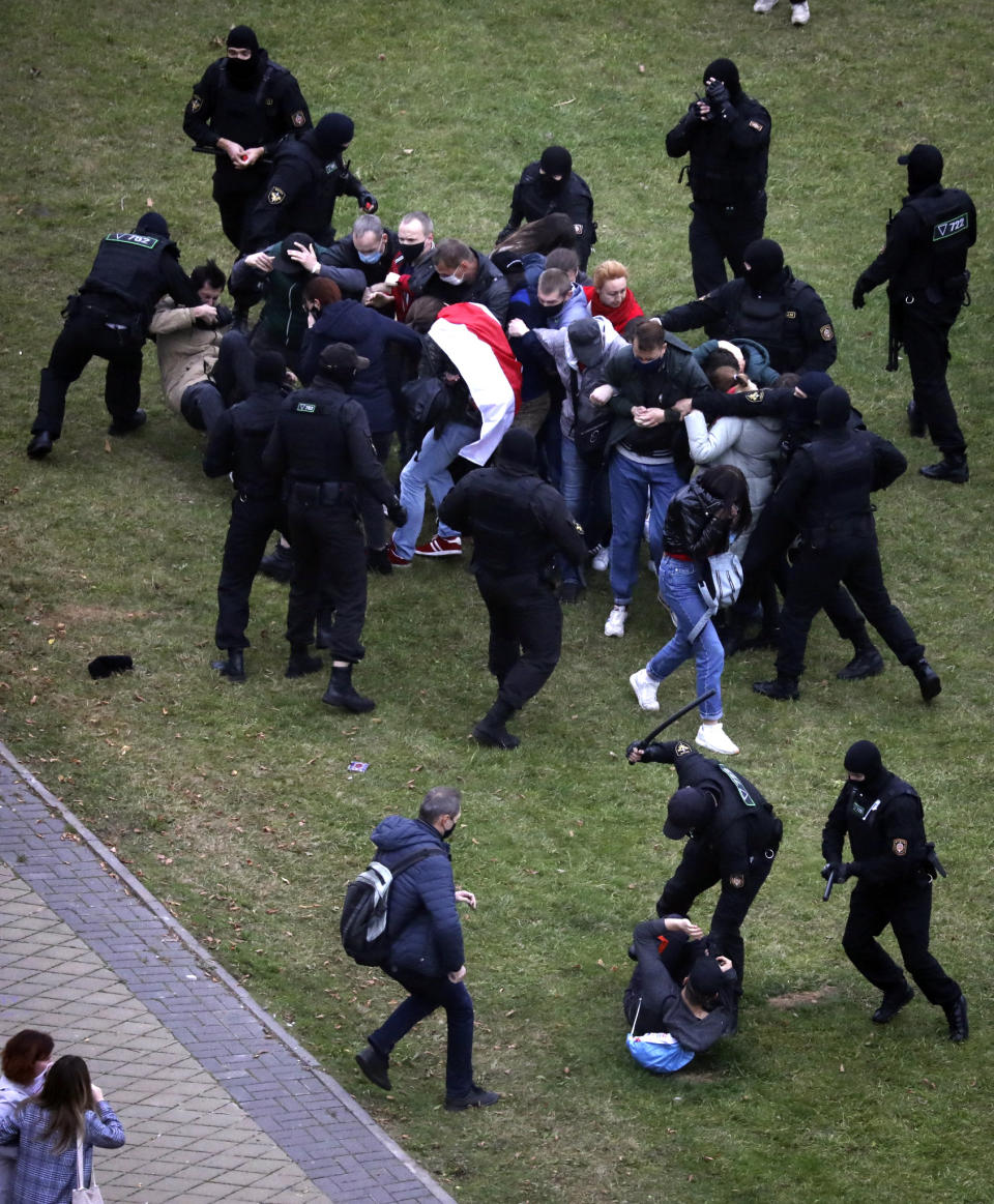 People clash with policemen during an opposition rally to protest the official presidential election results in Minsk, Belarus, Sunday, Oct. 11, 2020. Belarus' authoritarian president Alexander Lukashenko on Saturday visited a prison to talk to opposition activists, who have been jailed for challenging his re-election that was widely seen as manipulated and triggered two months of protests. (AP Photo)