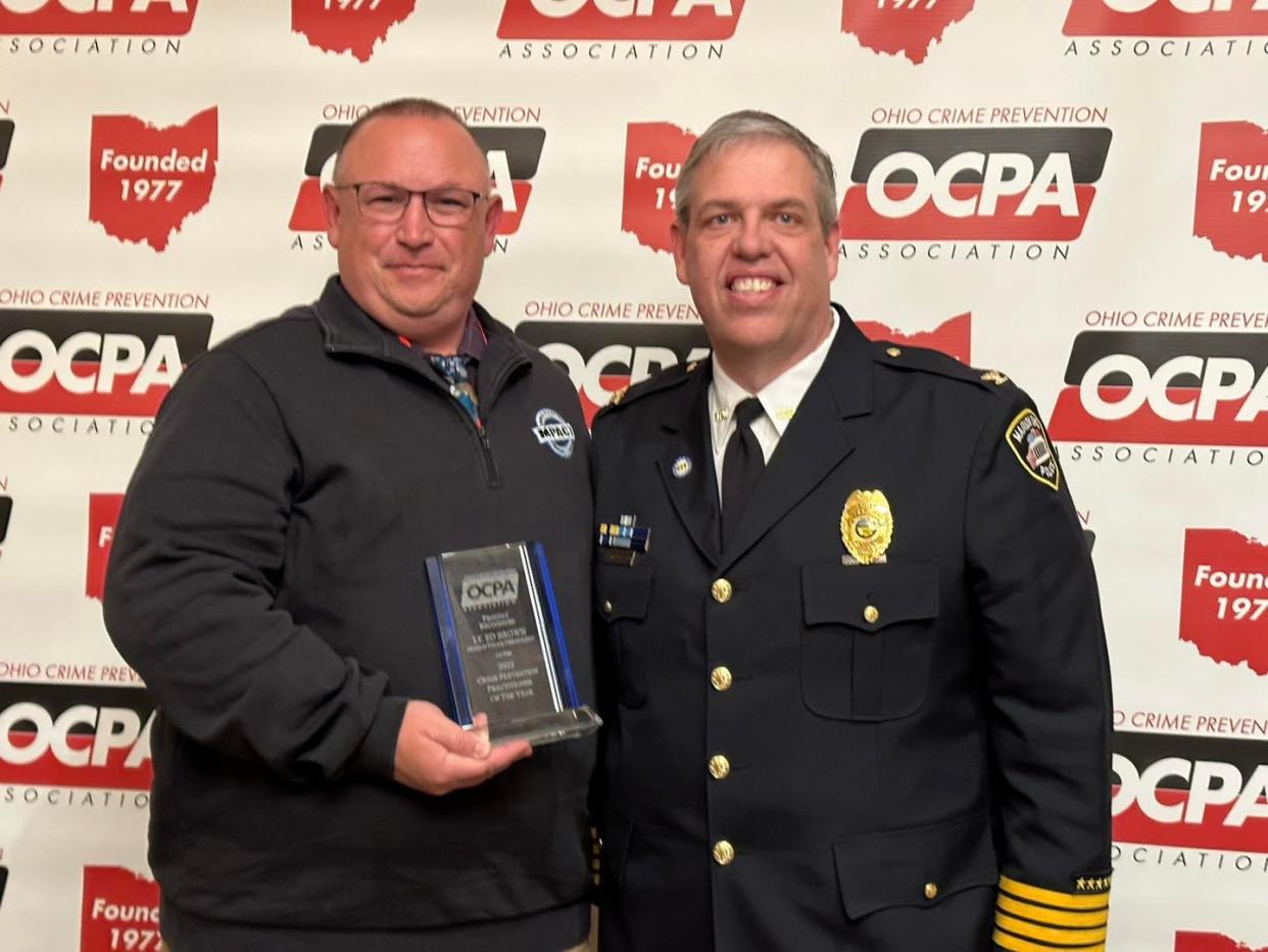 Lt. Ed Brown, left, of the Marion Police Department was selected as the Ohio Crime Prevention Association Practitioner of the Year for his work with the department's MPACT (Marion Police and Community Together) program. Chief Jay McDonald and former MPACT coordinator Major B.J. Gruber were at the conference for the award ceremony on April 4, 2023, in Dublin.