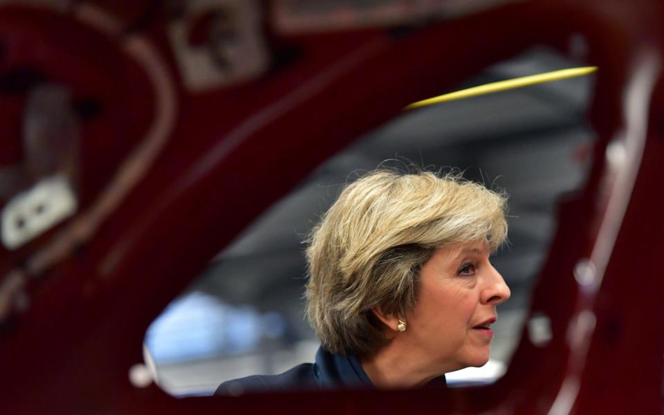 Prime Minister Theresa May views a car production line during a visit to the Jaguar Land Rover factory in Solihull where she used the visit to highlight that Britain continues to be open for economic investment following the country's decision to leave the European Union. PRESS ASSOCIATION Photo. Picture date: Thursday September 1, 2016. See PA story POLITICS May Brexit. Photo credit should read: Carl Court/PA Wire - Credit: Carl Court/ PA