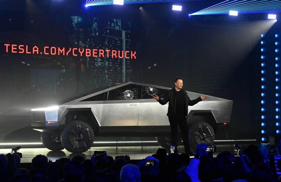 Tesla CEO Elon Musk unveils the Cybertruck at the TeslaDesign Studio in Hawthorne, Calif. on November 21, 2019. The cracked window glass occurred during a demonstration on the strength of the glass.