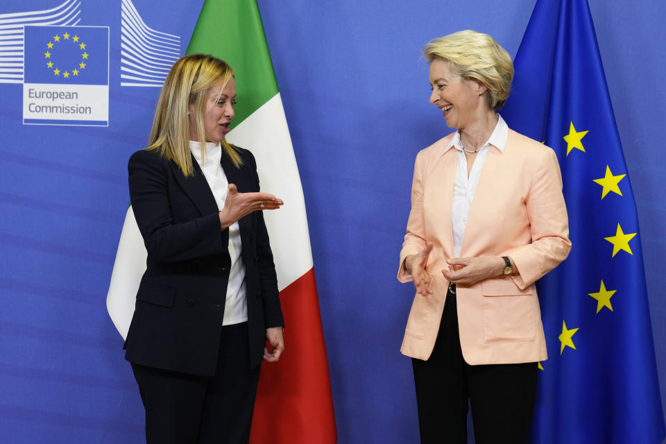 European Commission President Ursula von der Leyen, right, greets Italian Prime Minister Giorgia Meloni at EU headquarters in Brussels, Thursday, Nov. 3, 2022. New Italian Prime Minister Giorgia Meloni visits EU officials on Thursday, and it is no ordinary visit of the leader of a European Union founding nation to renew unshakable bonds with the 27-nation bloc. (AP Photo/Virginia Mayo)