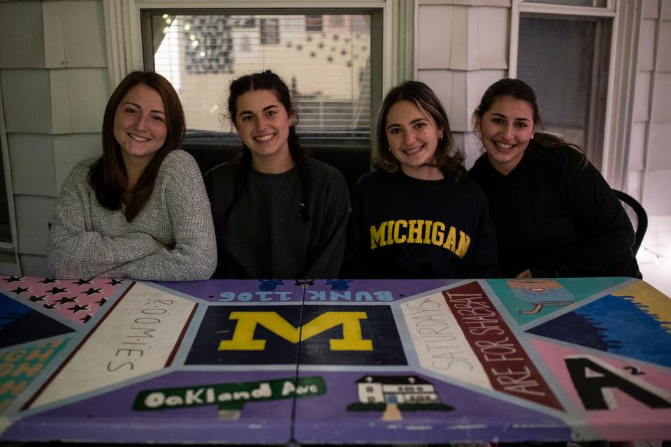 From left, U-M seniors Lena Stein, art major, Alyssa Dern, engineering major, Alana Woloshin, information science major and Amanda Kaplan, public policy major pose for a photo in the front porch of their house in Ann Arbor, Friday, Oct. 30, 2020.