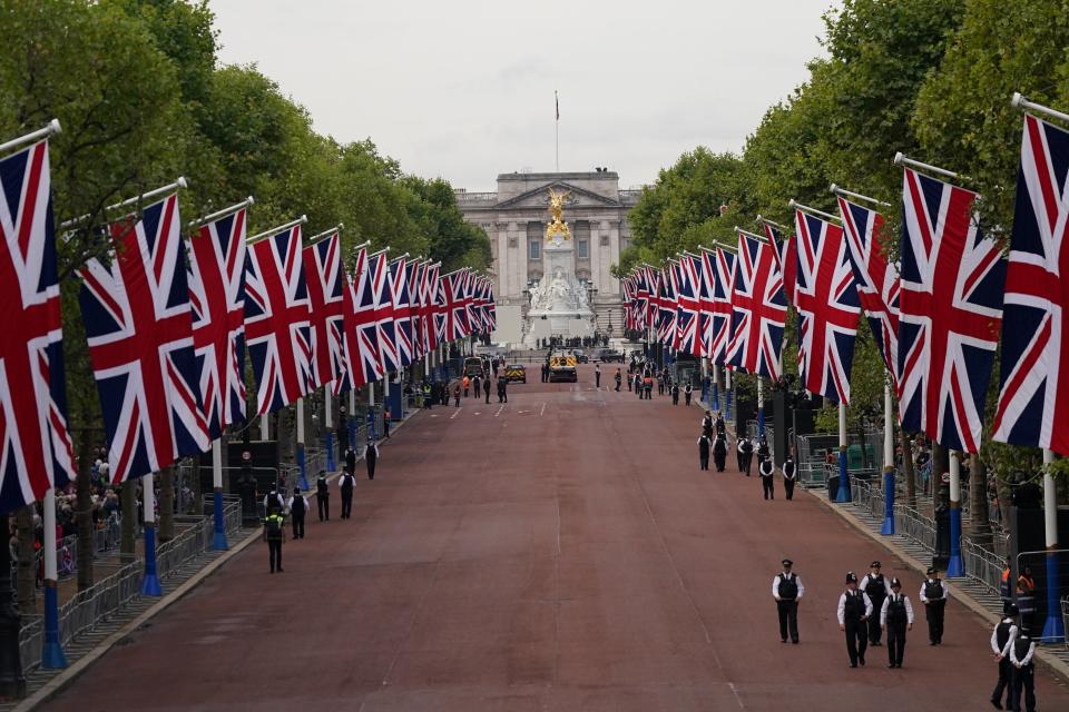 Crowds gather along The Mall ahead of the ceremonial procession of the coffin of Queen Elizabeth II from Buckingham Palace to Westminster Hall (via REUTERS)