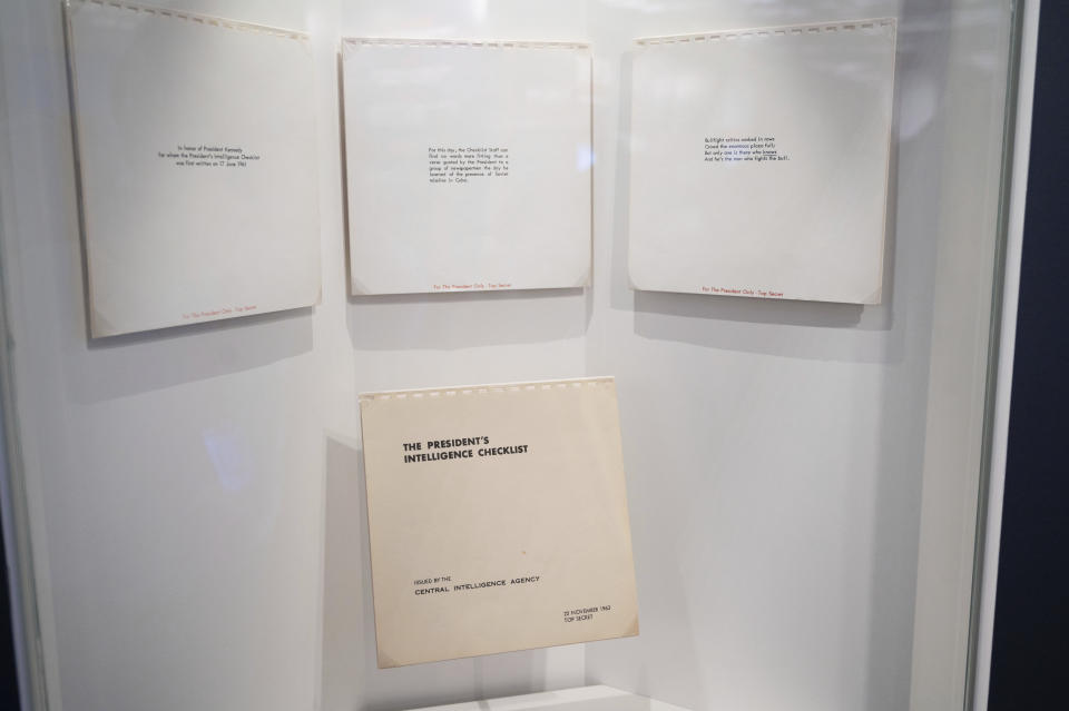 Copies of the President's Intelligence Checklist (PICL) from the day of President John F. Kennedy's assassination are displayed at the Central Intelligence Agency's newly refurbished museum in the headquarters building in Langley, Va., Saturday, Sept. 24, 2022. (AP Photo/Kevin Wolf)