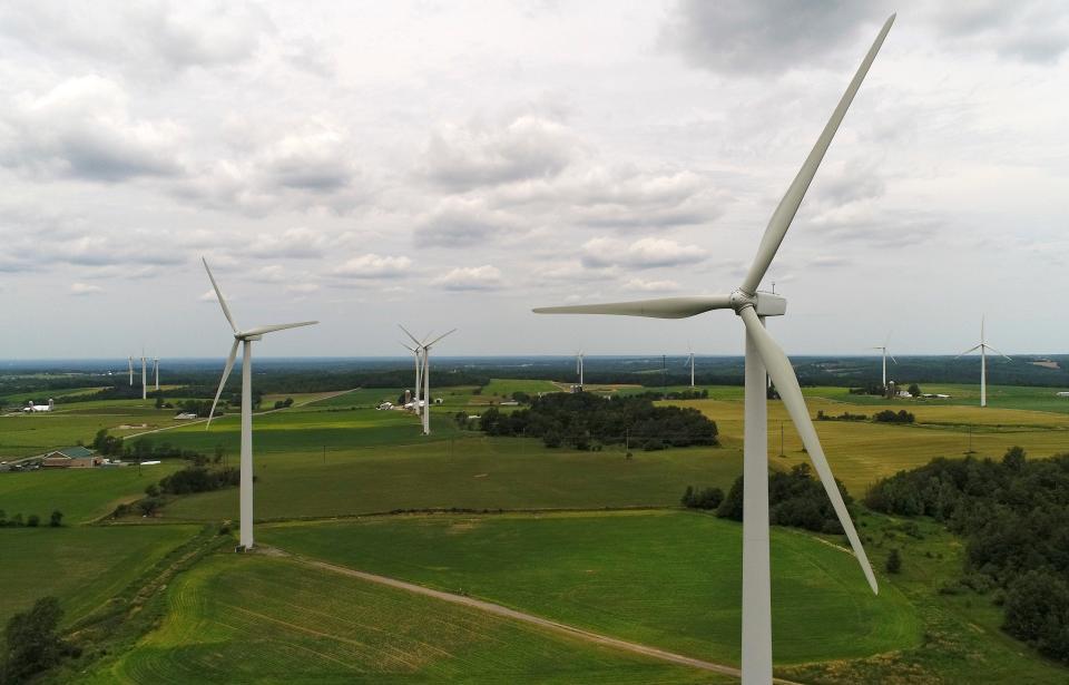 Wind turbines slowly spin in the wind at the High Sheldon Wind Farm, Monday, July 10, 2017, in Sheldon, N.Y. The farm is operated by Invenergy.