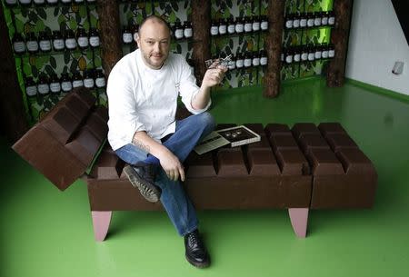 Belgian chocolatier Dominique Persoone poses with his Chocolate Shooter in his factory in Bruges, February 3, 2015. REUTERS/Francois Lenoir