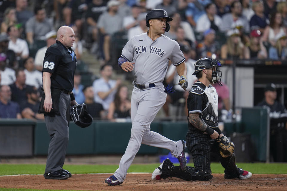 New York Yankees' Giancarlo Stanton scores on a double by Isiah Kiner-Falefa against the Chicago White Sox during the fourth inning of a baseball game Tuesday, Aug. 8, 2023, in Chicago. (AP Photo Erin Hooley)