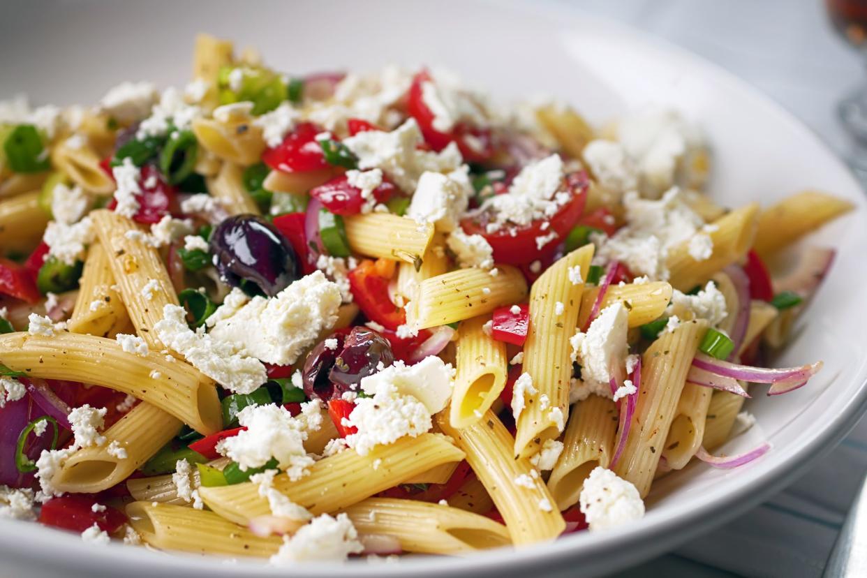 mediterranean veggie pasta with crumbled goat cheese, kalamata olives, penne, red onion, cherry tomatoes
