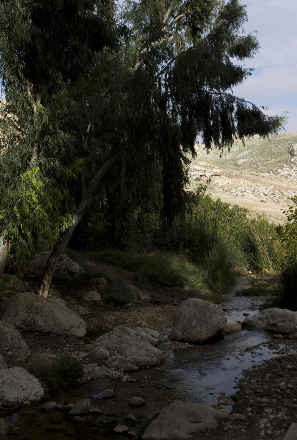 This Thursday, Dec. 13, 2012 photo shows Ein Mabua spring in the Judean Desert, between Jerusalem and the West Bank town of Jericho. Beyond its earthly past, Jerusalem has an impossible beauty with broad appeal. For residents and tourists, secular and religious souls, city slickers or nature lovers, there is always an unexplored alleyway, street corner or vista that will show you the city as you’ve never seen it before. (AP Photo/Ariel Schalit)