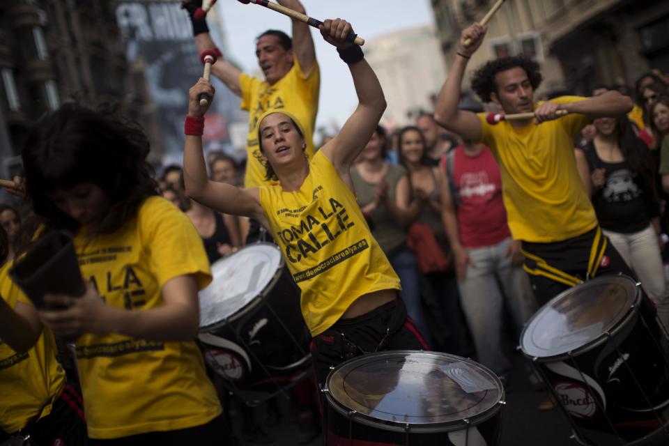 Demonstrators play drums as they march in a protest to mark the anniversary of the beginning of the "Indignados" movement in Barcelona, Spain, Saturday May 12, 2012. Spanish activists angered by grim economic prospects planned nationwide demonstrations Saturday to mark the one-year anniversary of their protest movement that inspired similar groups in other countries. The protests began May 15 last year and drew hundreds of thousands of people calling themselves the Indignant Movement. The demonstrations spread across Spain and Europe as anti-austerity sentiment grew. (AP Photo/Emilio Morenatti)