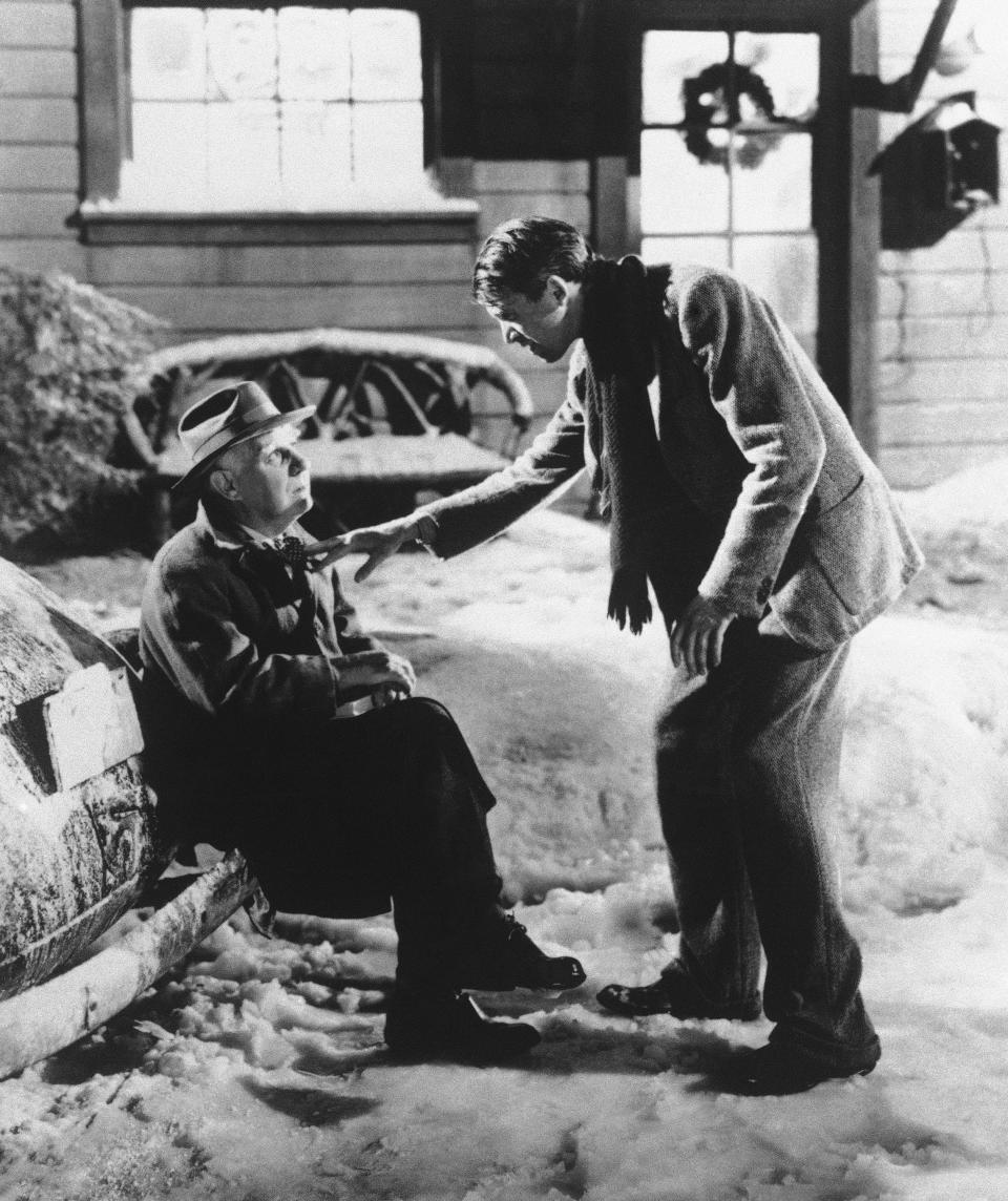 George Bailey (James Stewart, right) discovers his guardian angel, Clarence (Henry Travers) is trying to show him what the world would be like if he hadn't been born in "It's a Wonderful Life."