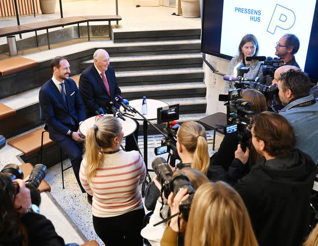 <p>Rune Hellestad - Corbis/Getty</p> King Harald and Crown Prince Haakon visit Faktisk.no at Norwegian Press Association on January 23.