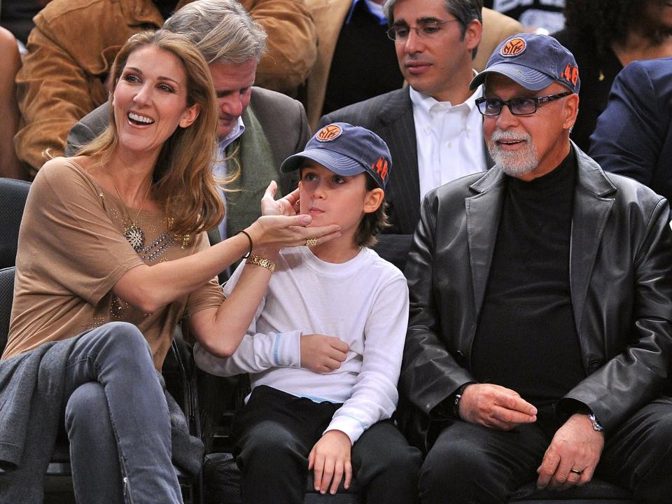 Celine Dion, Rene Charles Angelil and Rene Angelil attend the Portland Trailblazers Vs. New York Knicks game at Madison Square Garden on December 7, 2009 in New York City