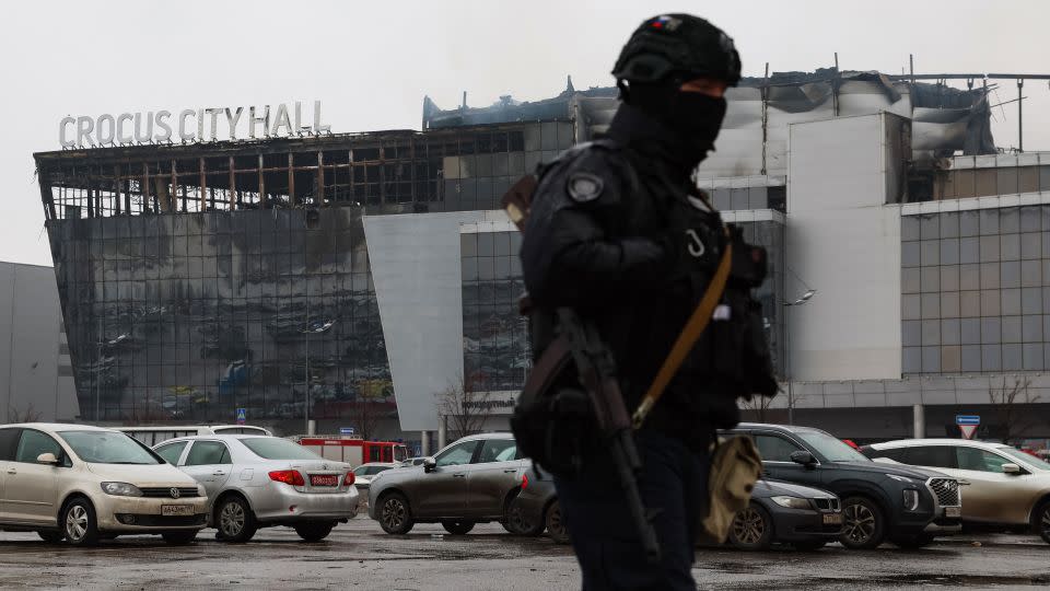 A law enforcement officer patrols the scene of the gun attack on Saturday. - Stringer/AFP/Getty Images