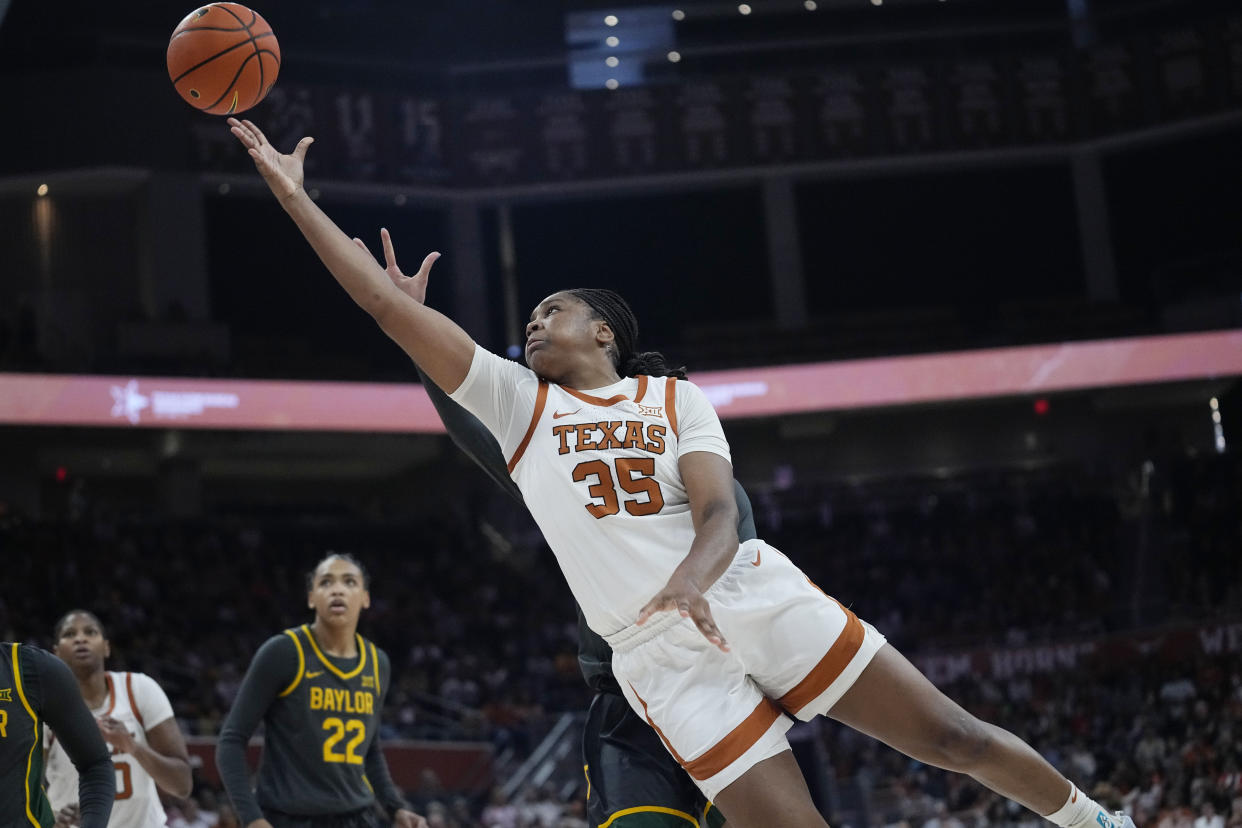 Texas forward Madison Booker (35) scores against Baylor during the second half of an NCAA college basketball game in Austin, Texas, Saturday, Dec. 30, 2023. (AP Photo/Eric Gay)