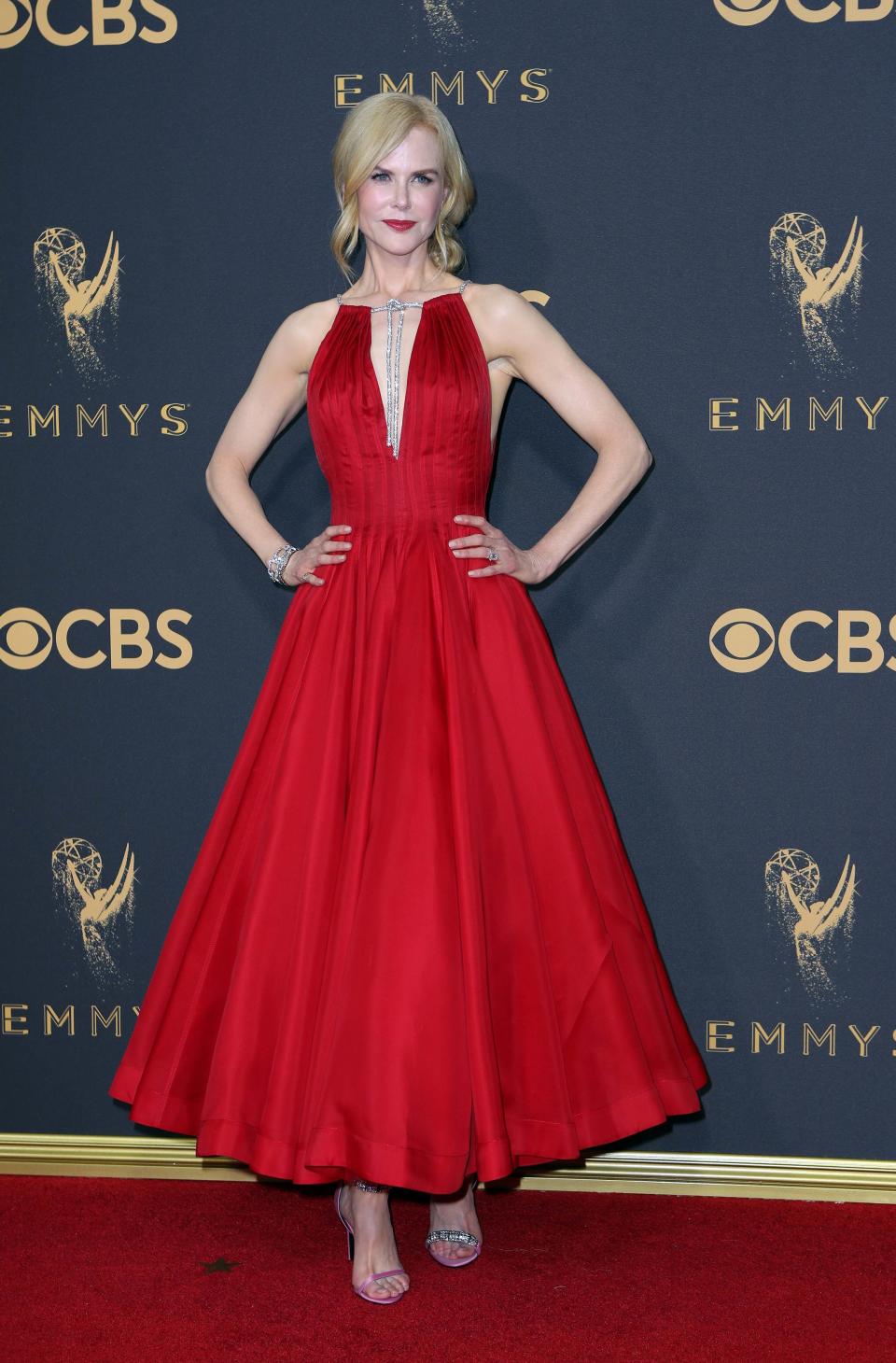 <p>Nicole Kidman, nominated for Best Actress in a Limited Series for her role in <em>Big Little Lies</em>, wore red to walk the red carpet. Her tea-length Calvin Klein dress featured a deep V-neck, which highlighted the large diamonds hanging from her neck. (Photo: Reuters) </p>